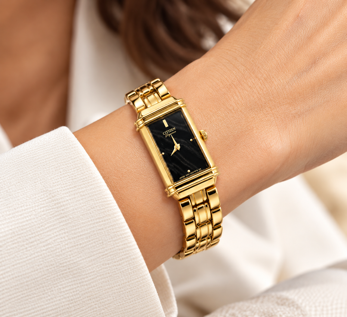 Vintage Citizens Elegance women's tank watch featuring a gold-tone bracelet and a beveled crystal
