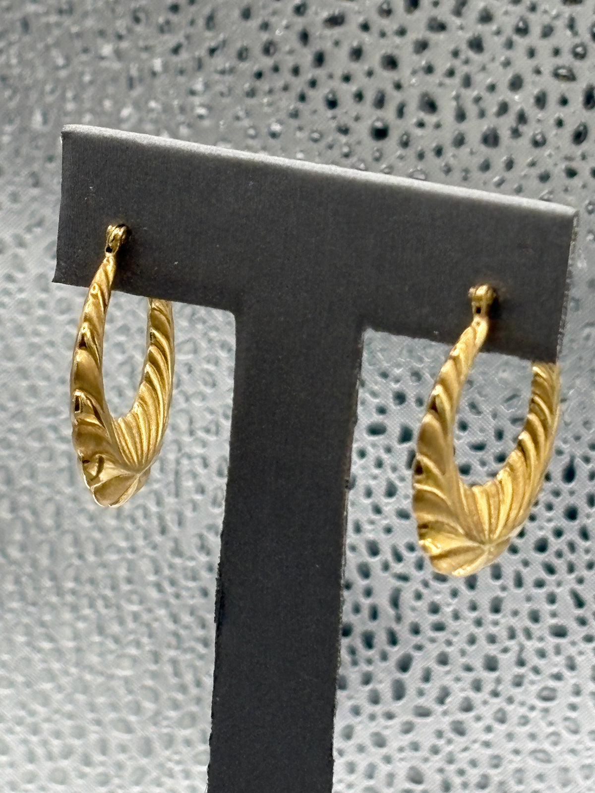 View one of Ladies 14 Karat Yellow Gold Fluted Floral Hoop Earrings
