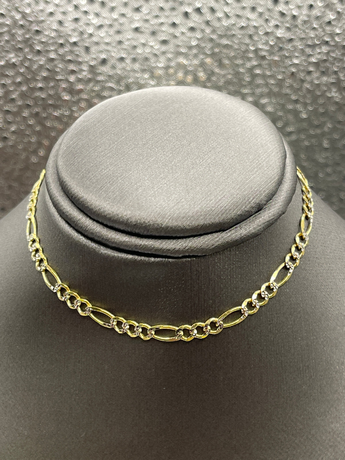 10 Karat Two-Tone Yellow and White Gold Beveled Figaro Bracelet