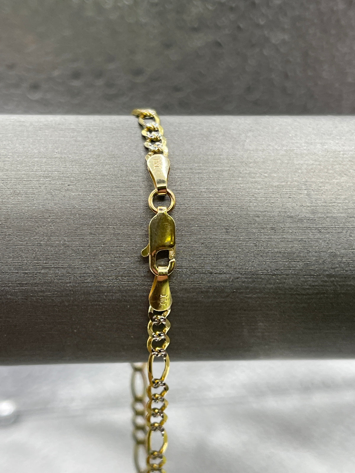 10 Karat Two-Tone Yellow and White Gold Beveled Figaro Bracelet