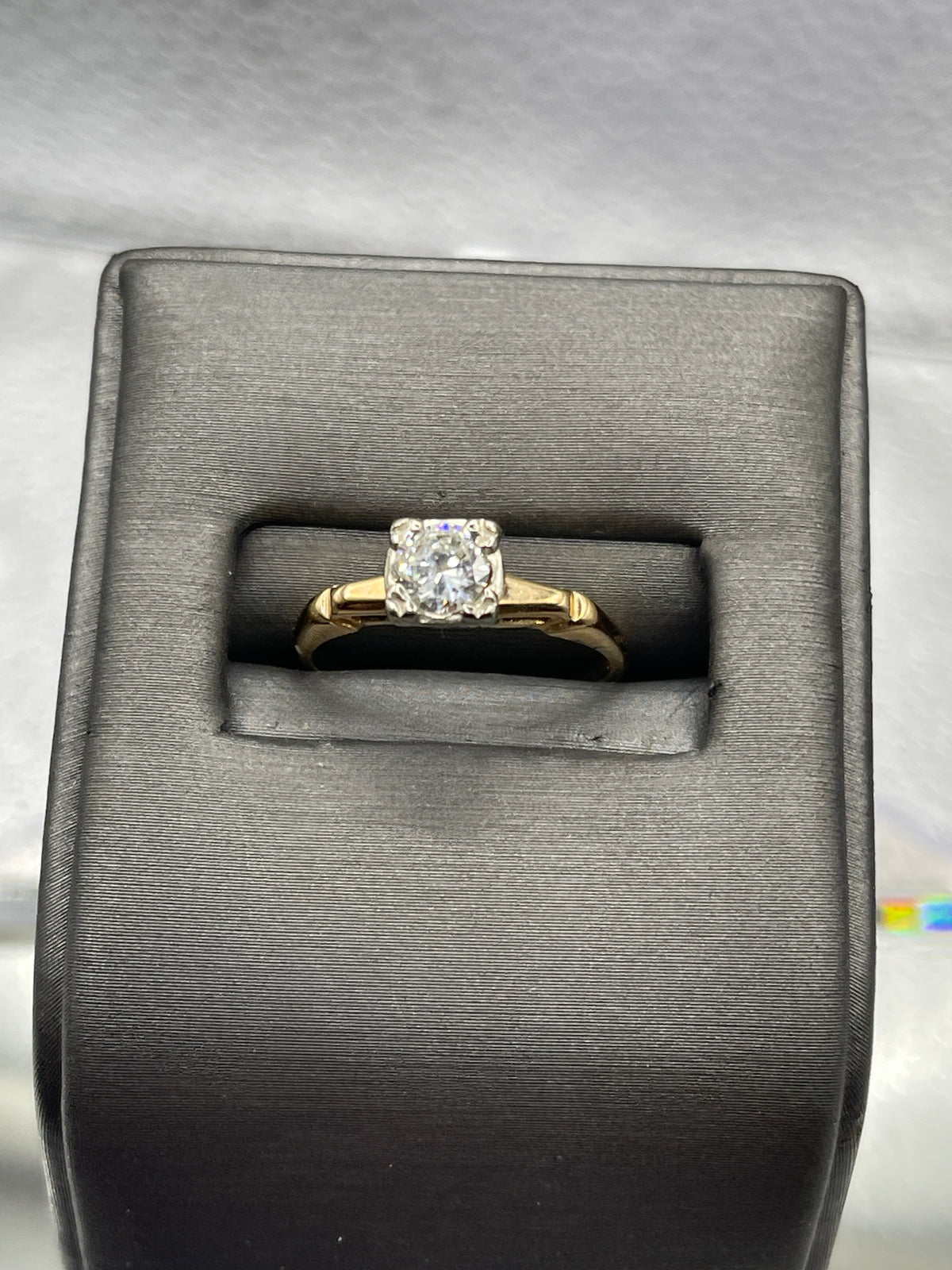 A ladies Vintage 14 Karat Yellow Gold Diamond Engagement Ring