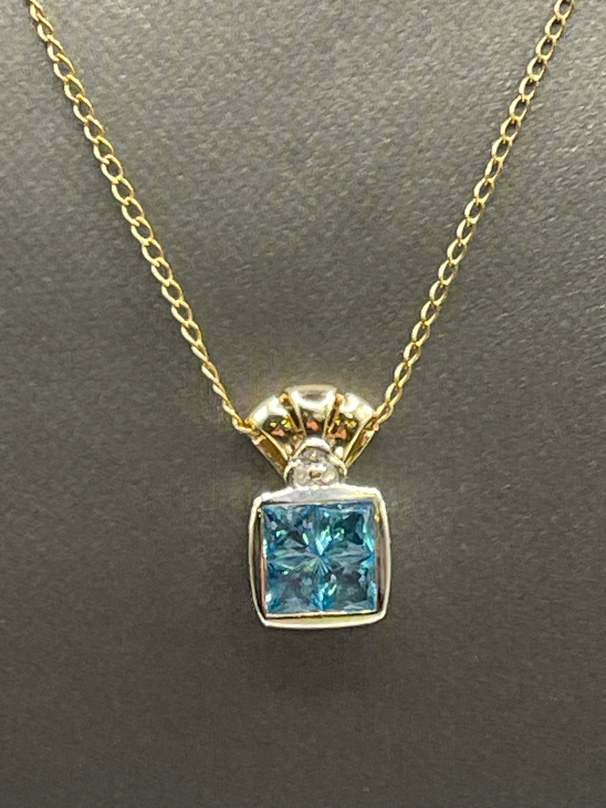 Ladies 14 Karat Solid Two-Toned Gold Blue Topaz and Diamond Pendant