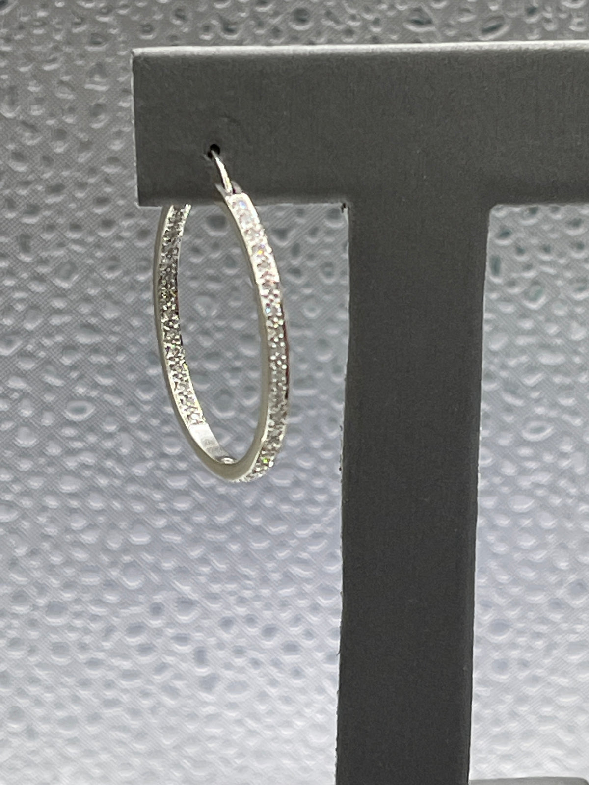 View one of 14 Karat White Gold Single Pierced Diamond Inside Out Hoop Earring