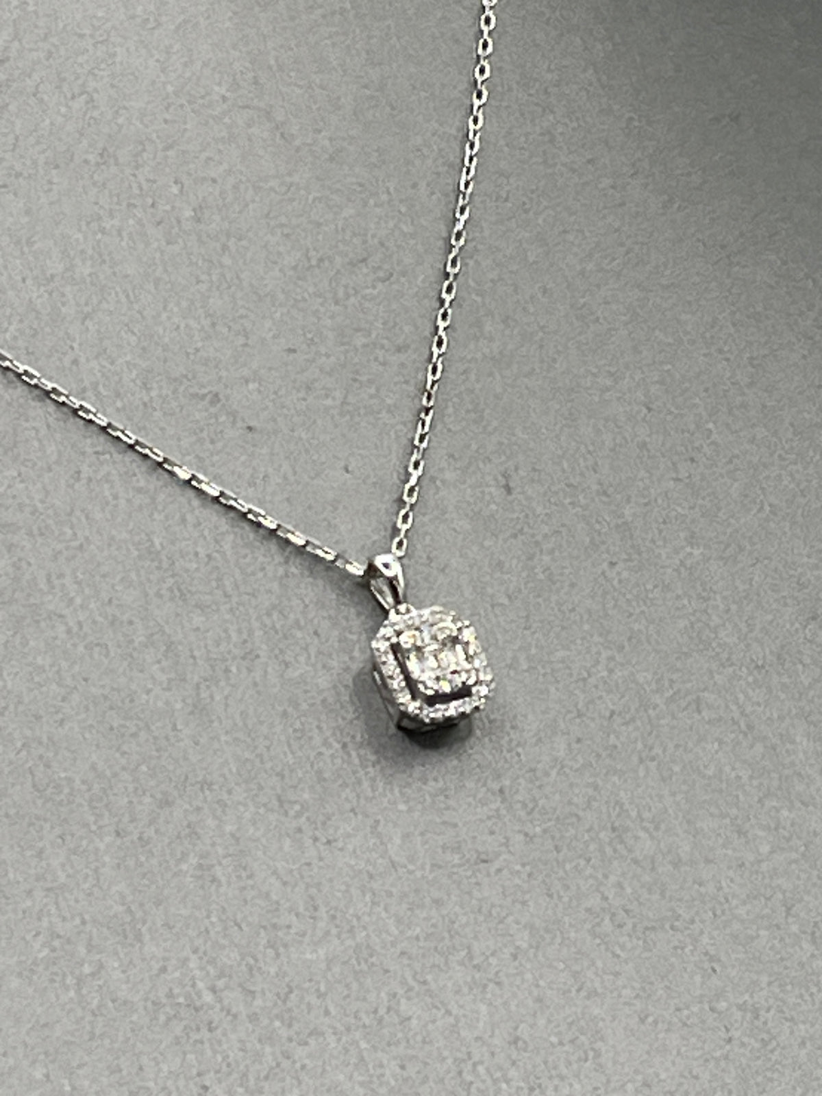 Ladies 18 Karat White Gold Emerald & Round Diamond Halo Pendant & Chain