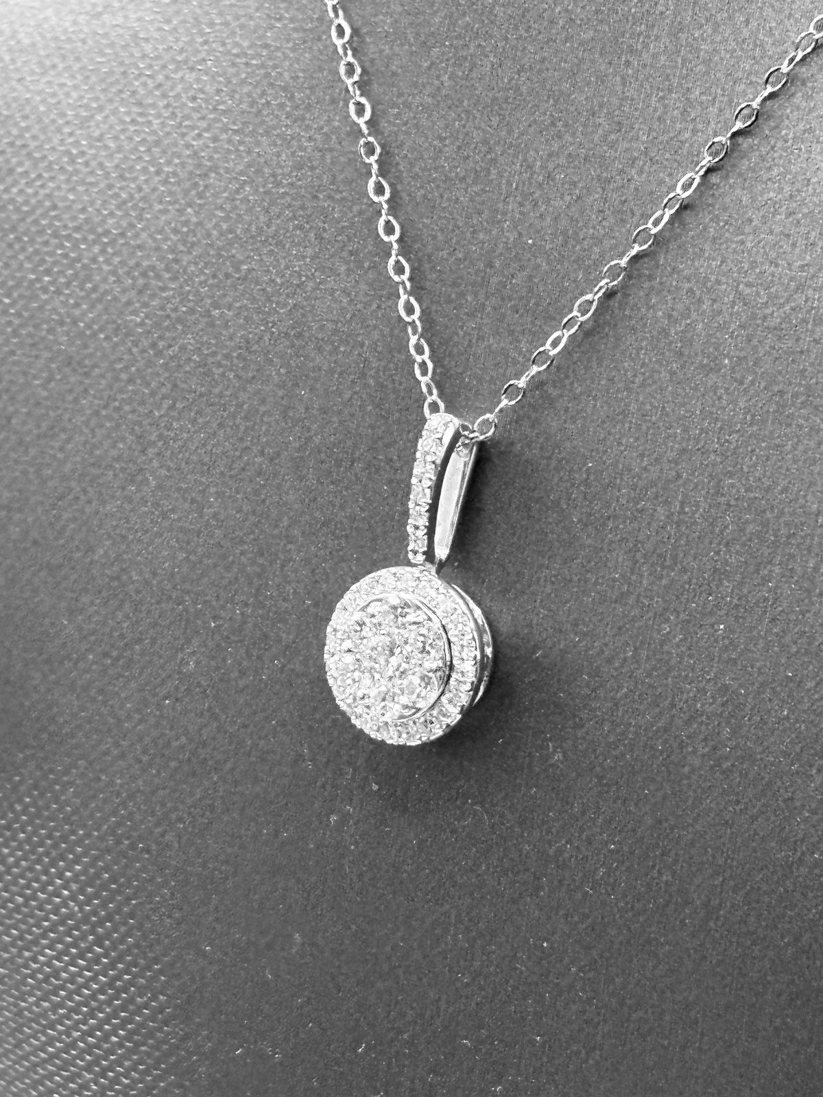 14kt solid white gold, ladies diamond cluster pendant with diamond halo and diamond bale, hanging from a 16’’ pendant chain