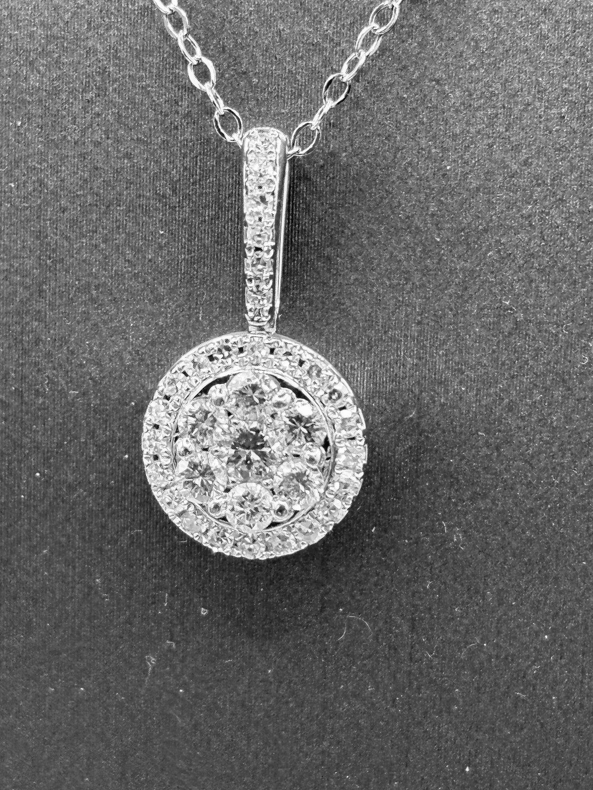 14kt solid white gold, ladies diamond cluster pendant with diamond halo and diamond bale, hanging from a 16’’ pendant chain
