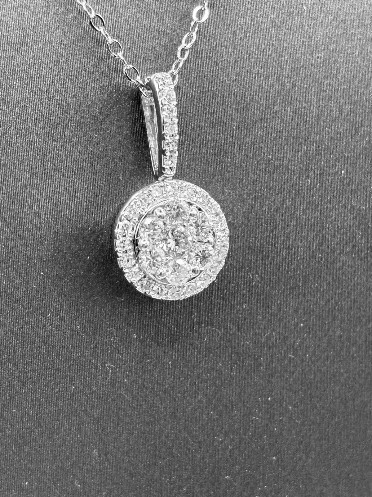 14kt solid white gold, ladies diamond cluster pendant with diamond halo and diamond bale, hanging from a 16’’ pendant chain