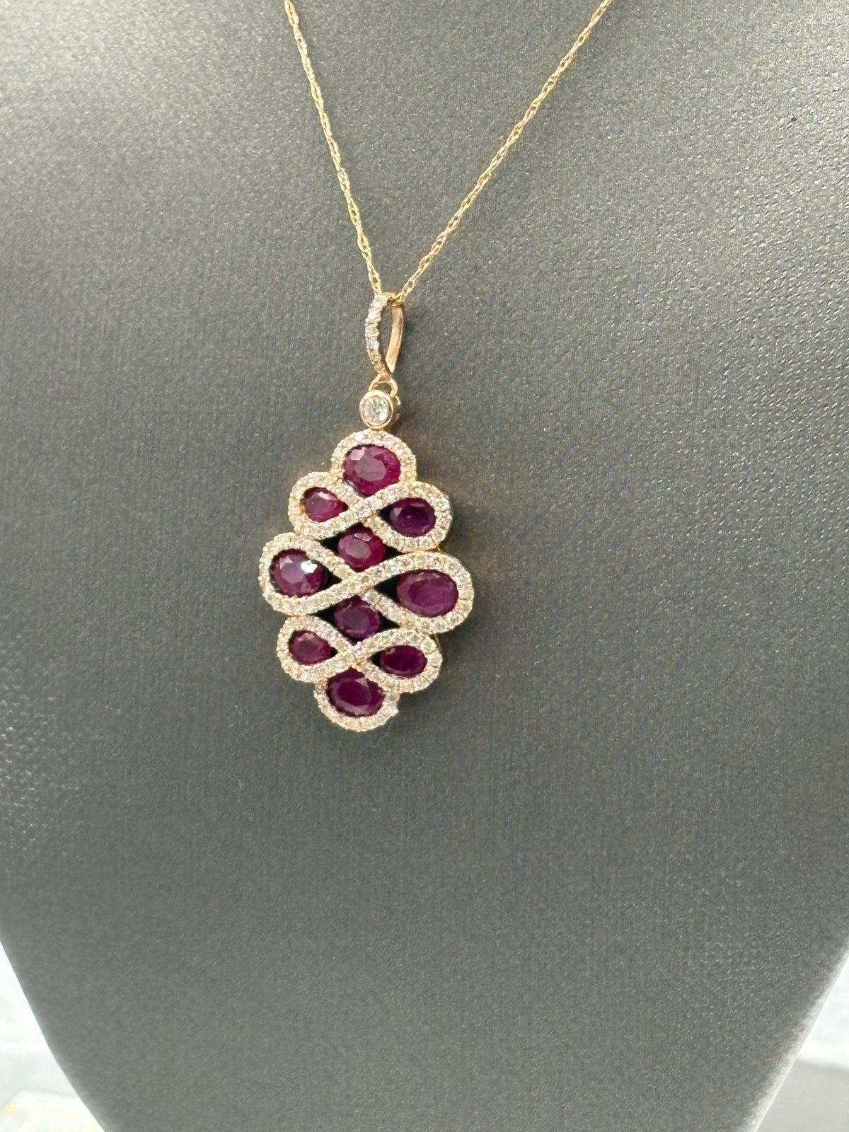 View one of Ladies 14 Karat Rose Gold Ruby/Diamond Pendant & Chain