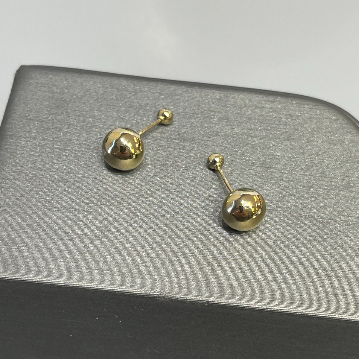 View two of 14 Karat Yellow Gold Double Ball Pierced Earrings