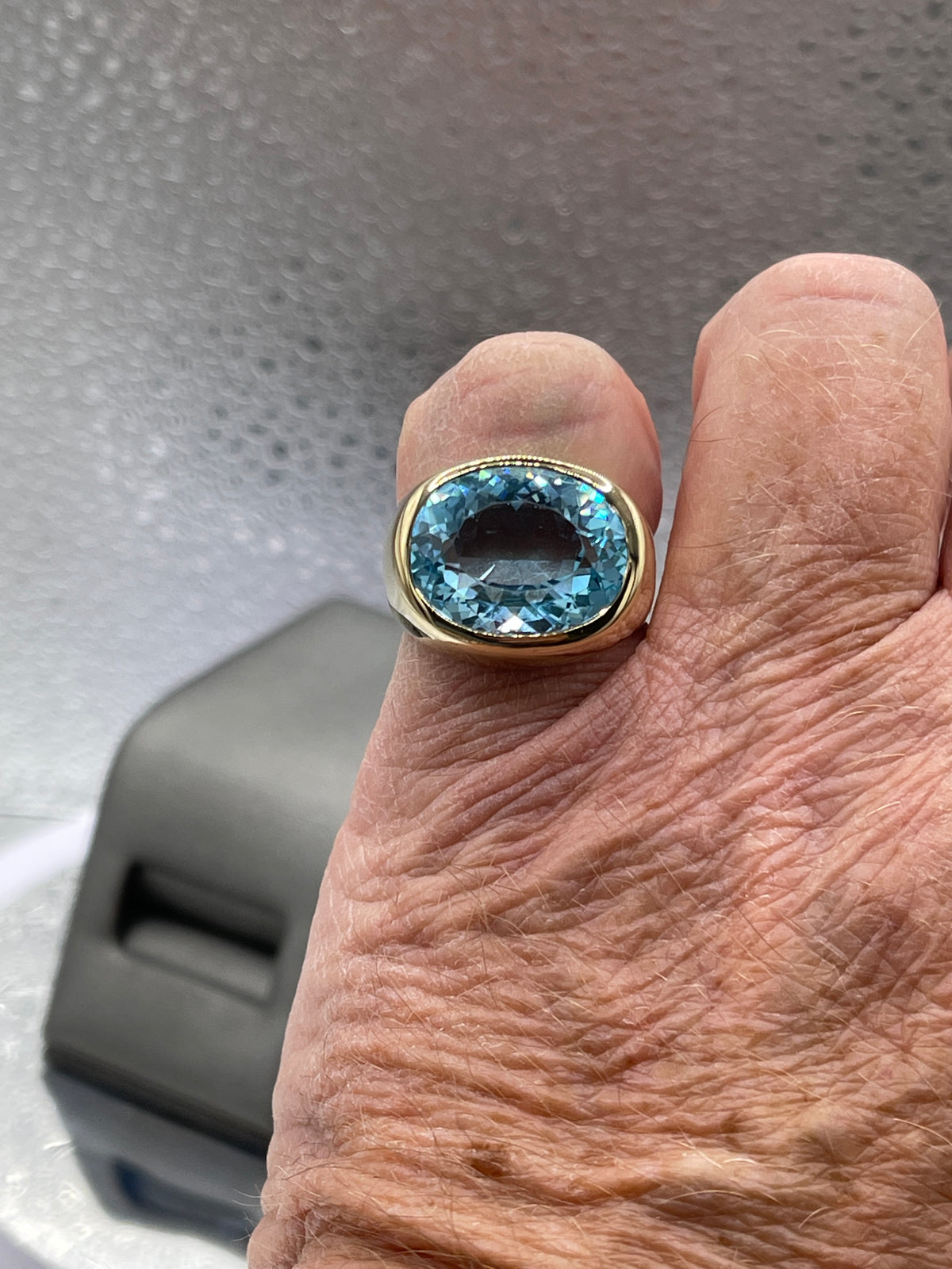 A Fabulous Ladies or Mens 14 Karat Yellow Gold Oval Blue Topaz Ring