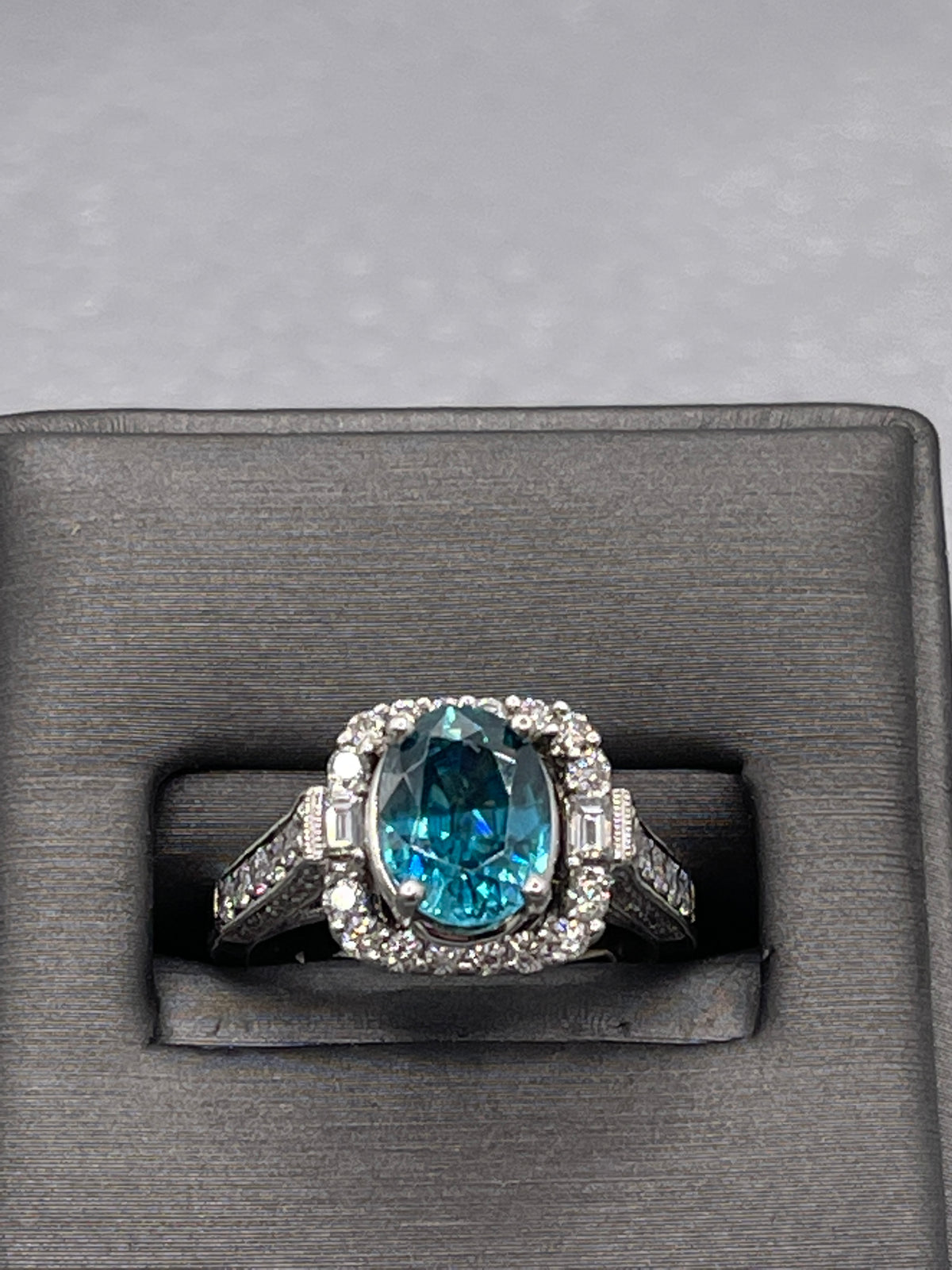 14 Karat White Gold 2 Carat Oval Blue Topaz With Baguettes & Round Diamonds Ring