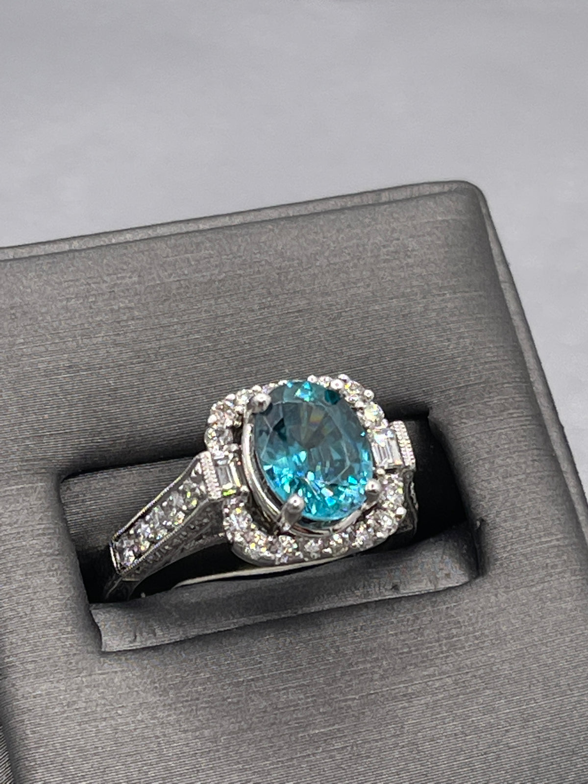 14 Karat White Gold 2 Carat Oval Blue Topaz With Baguettes & Round Diamonds Ring