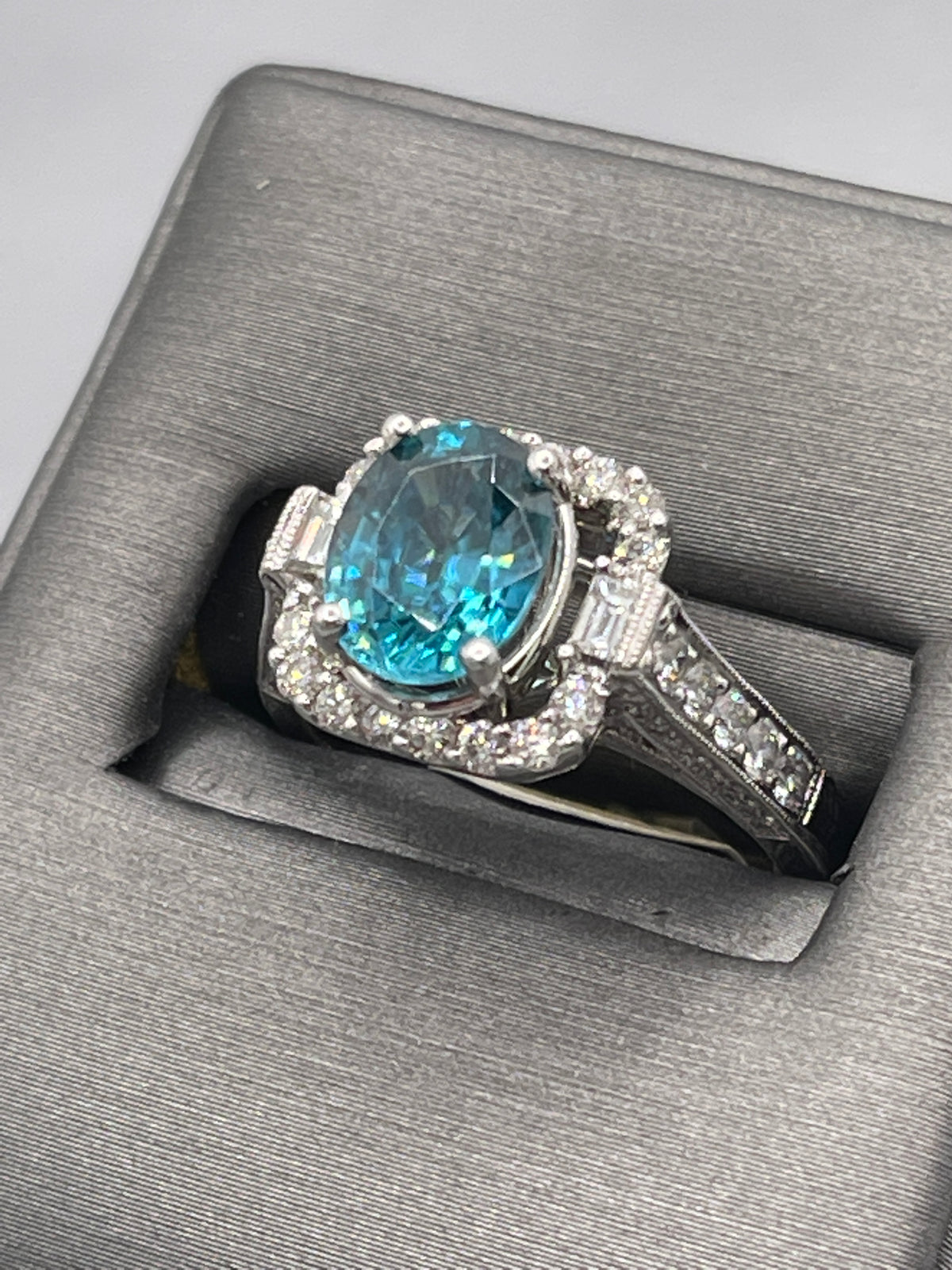 14 Karat White Gold 2 Carat Oval Blue Topaz With Baguettes & Round Diamonds Ring