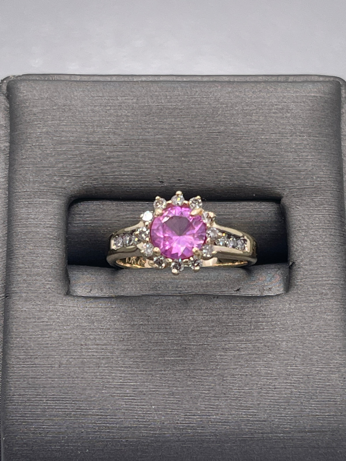 A Ladies 10 Karat Yellow Gold Pink Topaz & Diamond Halo Ring