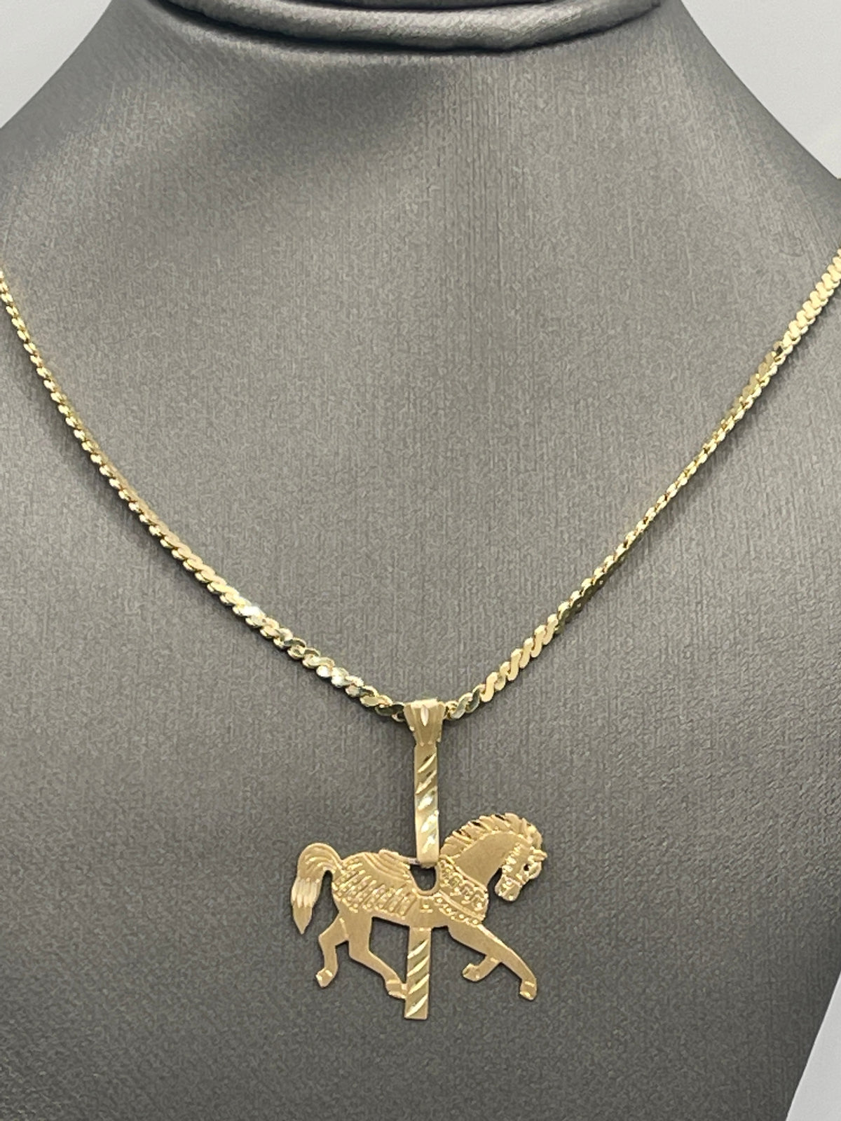 A Ladies Vintage Michael Anthony14 Karat Yellow Gold Carousel Horse Pendant
