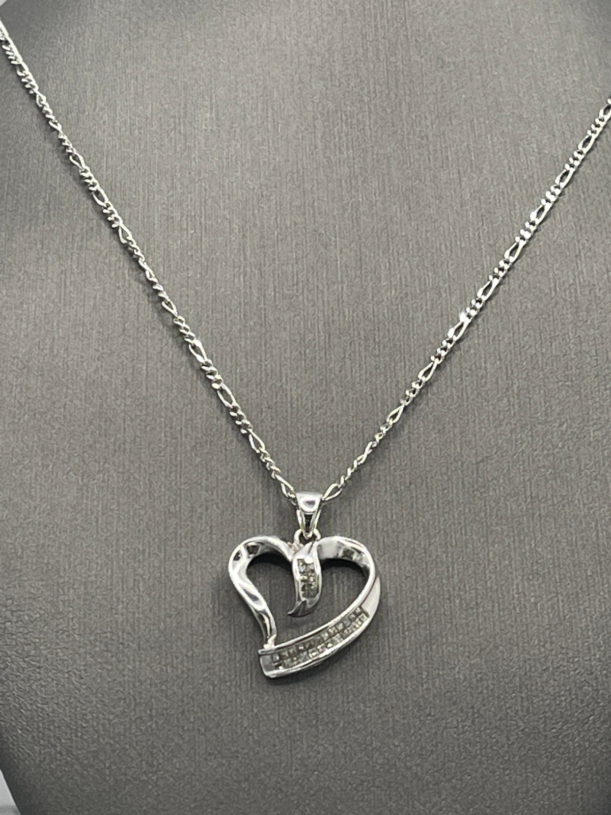 A Ladies 10 Karat White Gold Diamond Heart Pendant