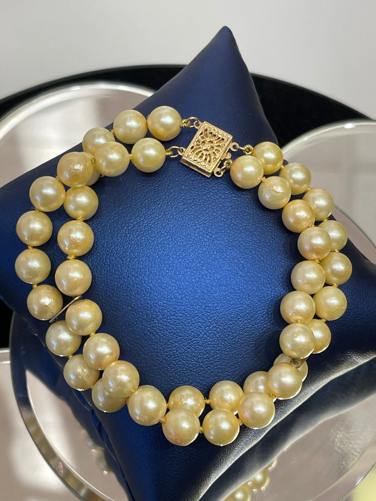 View one of 14 KARAT YELLOW GOLD AND DOUBLE STRAND PEARL BRACELET