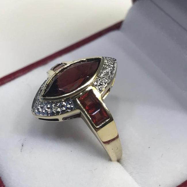 View six of 10 Karat Yellow Gold Garnet And Diamond Accent Ring