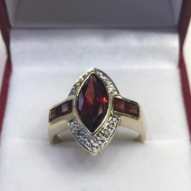 View five of 10 Karat Yellow Gold Garnet And Diamond Accent Ring