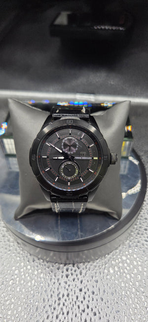 Vintage Pierre Bernard watch features a black dial with subdials and a black leather strap with white stitching