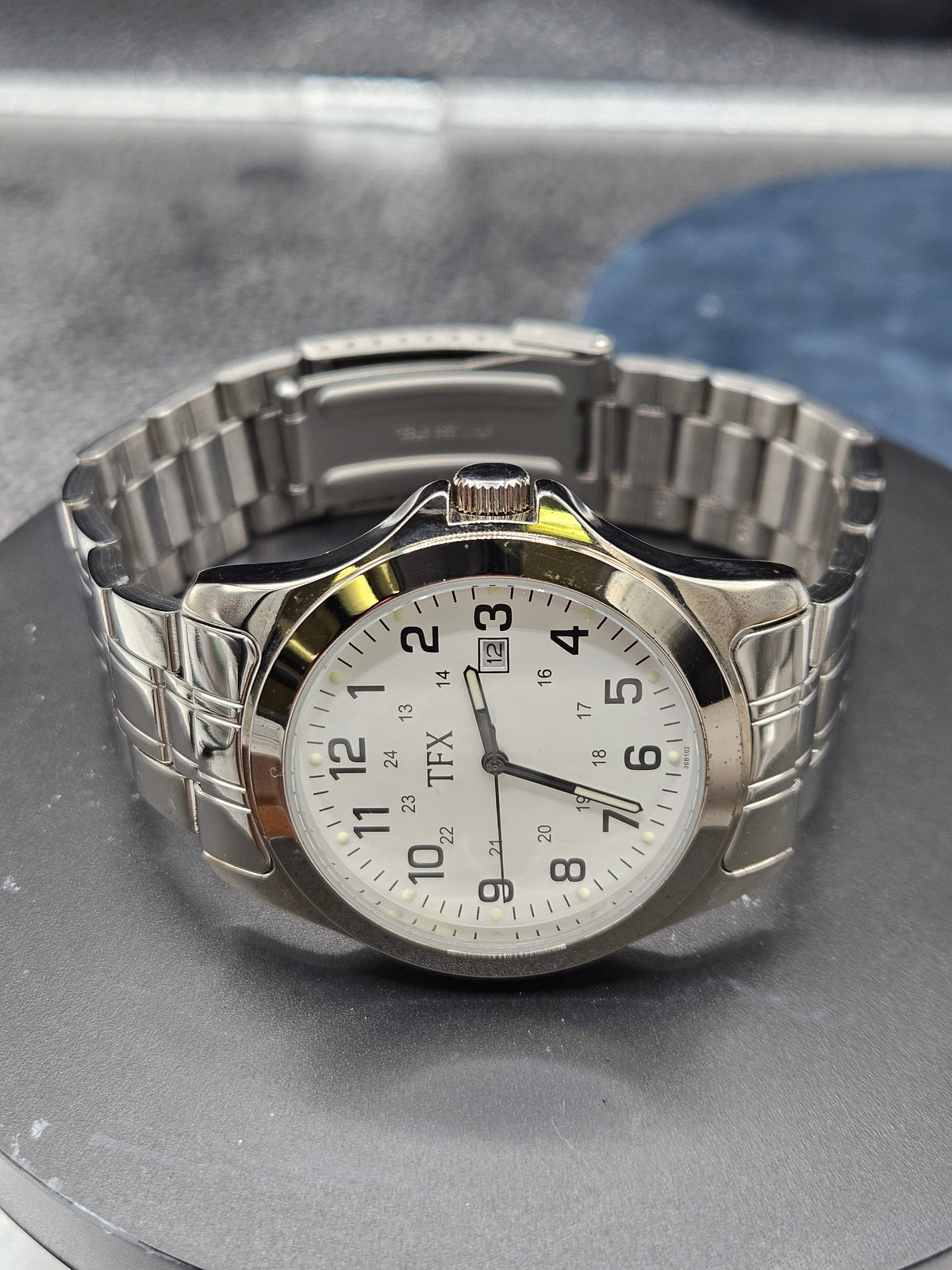 Vintage TFX by Bulova stainless steel date white enamel dial mens watch