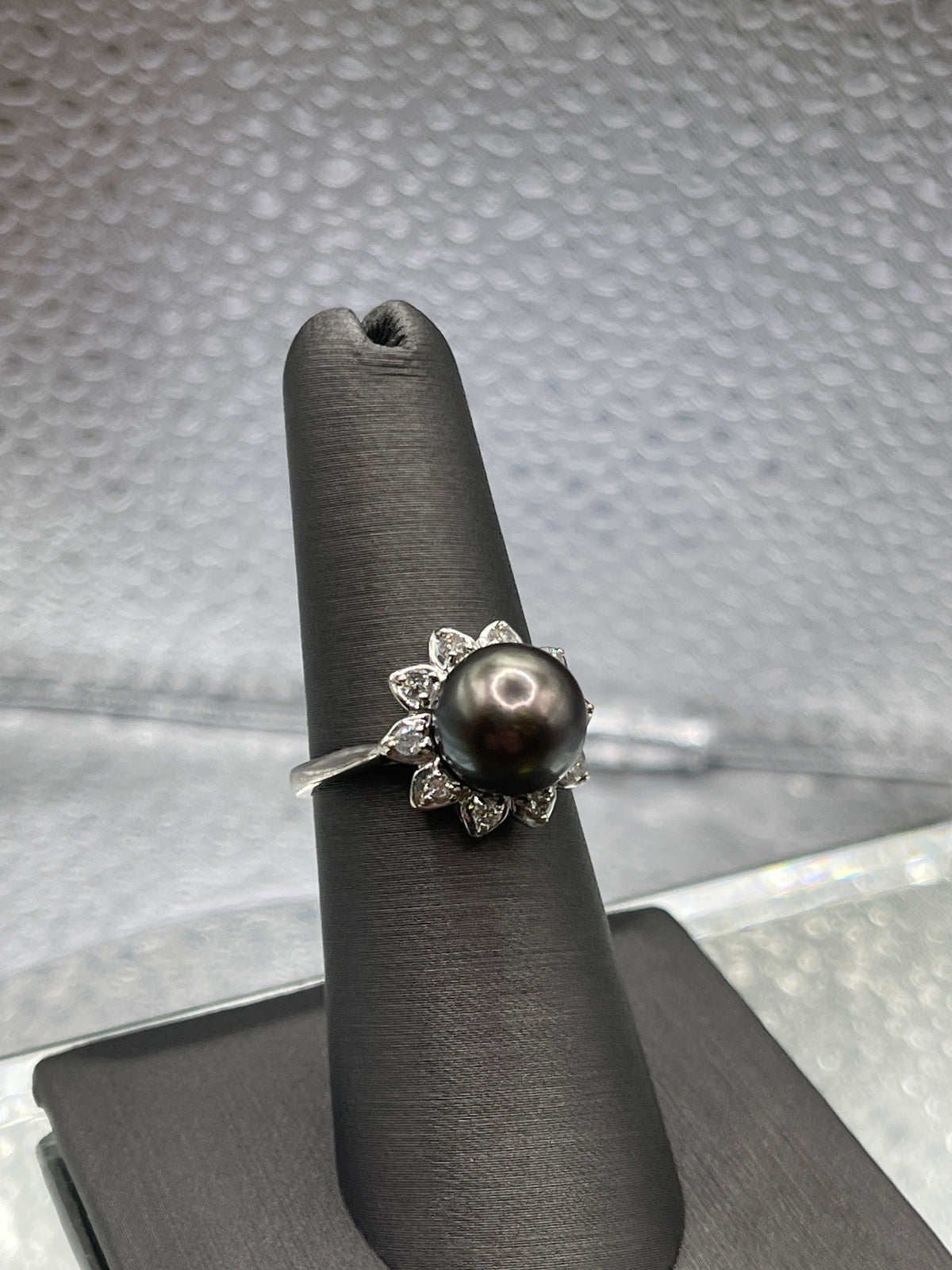 A Beautiful Ladies 14 Karat White Gold Diamond and Black Pearl Ring