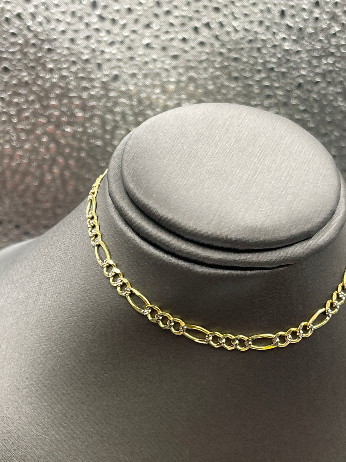 10 Karat Two-Tone Yellow and White Gold Beveled Figaro Bracelet