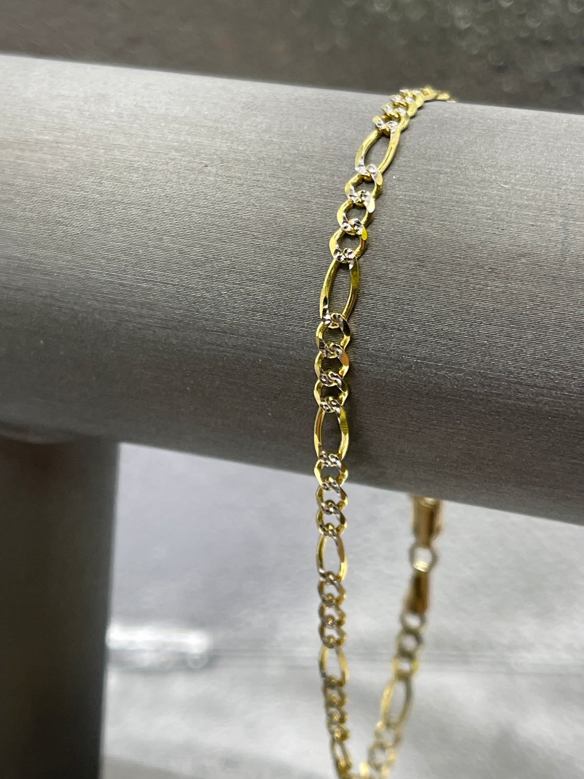 10 Karat Two-Tone Yellow and White Gold Beveled Figaro Bracelet