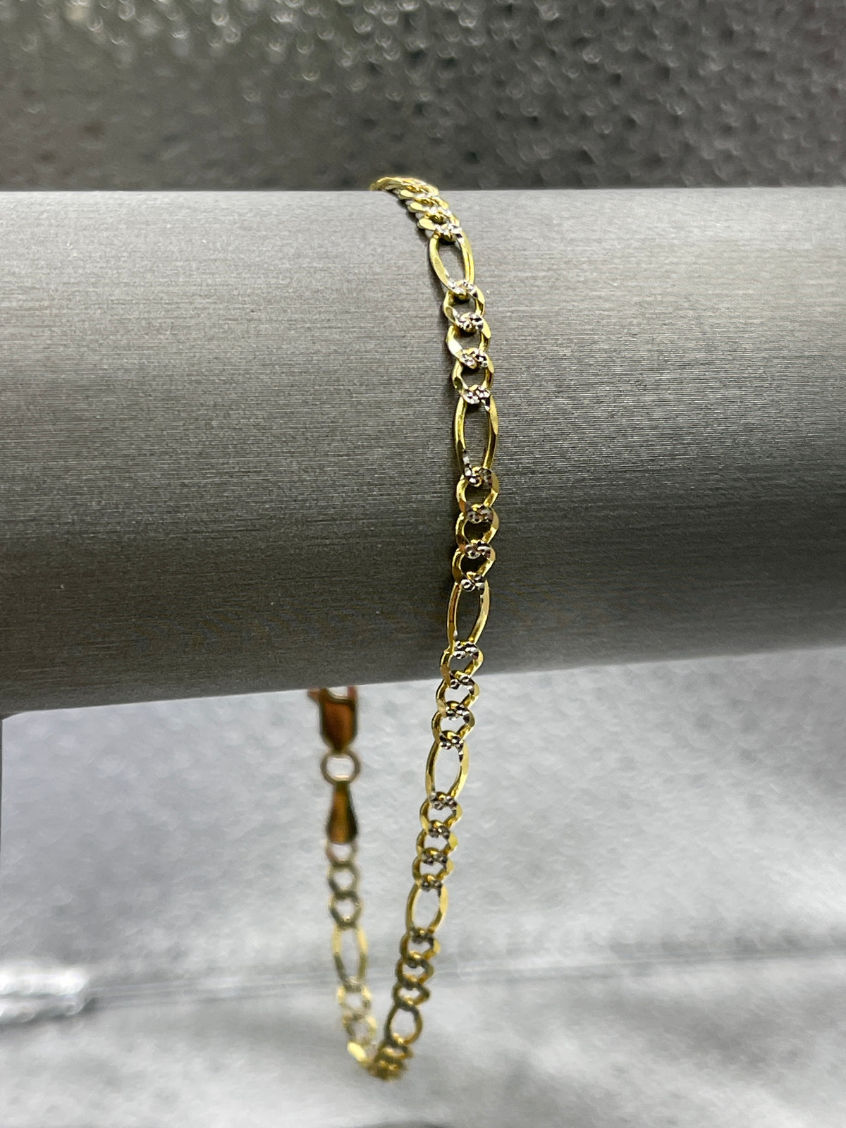 10 Karat Two-Tone Yellow and White Gold Beveled Figaro Bracelet