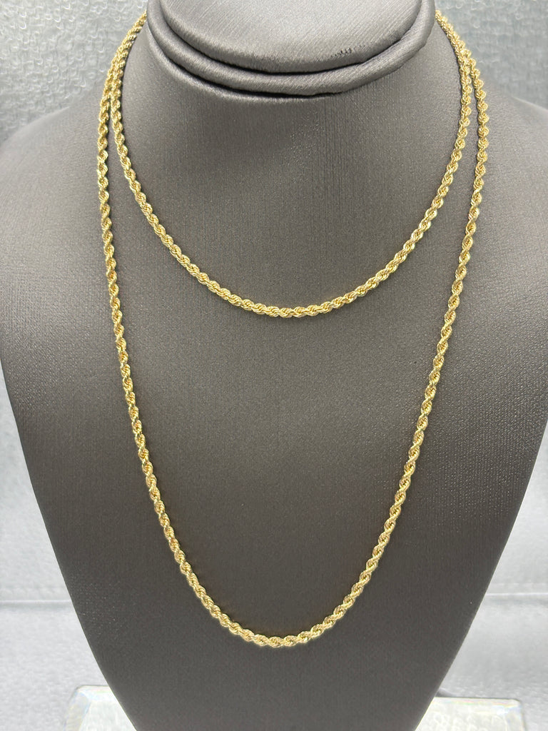 Gold chain on a gray mannequin bust