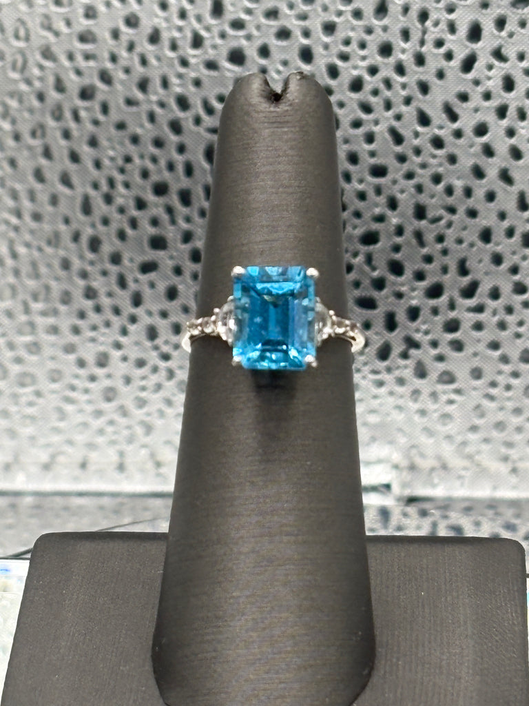 Ladies 10 Karat White Gold Emerald Cut Blue Topaz Ring