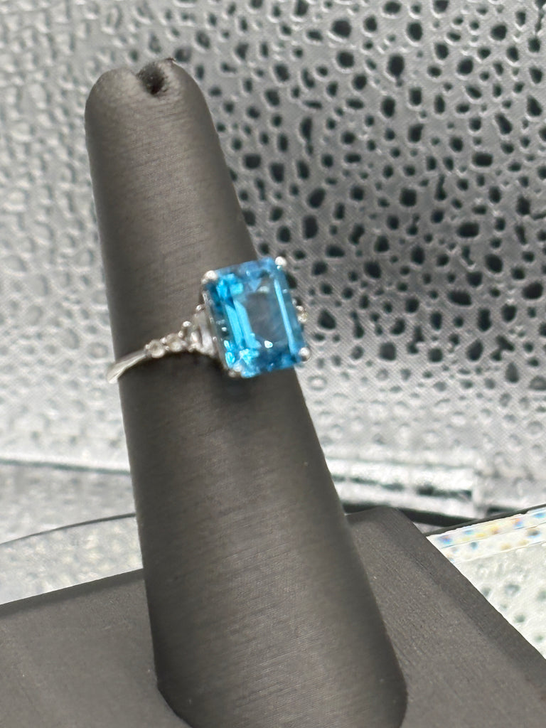 Ladies 10 Karat White Gold Emerald Cut Blue Topaz Ring