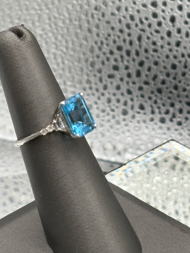 Ladies 10 Karat White Gold Emerald Cut Blue Topaz Ring