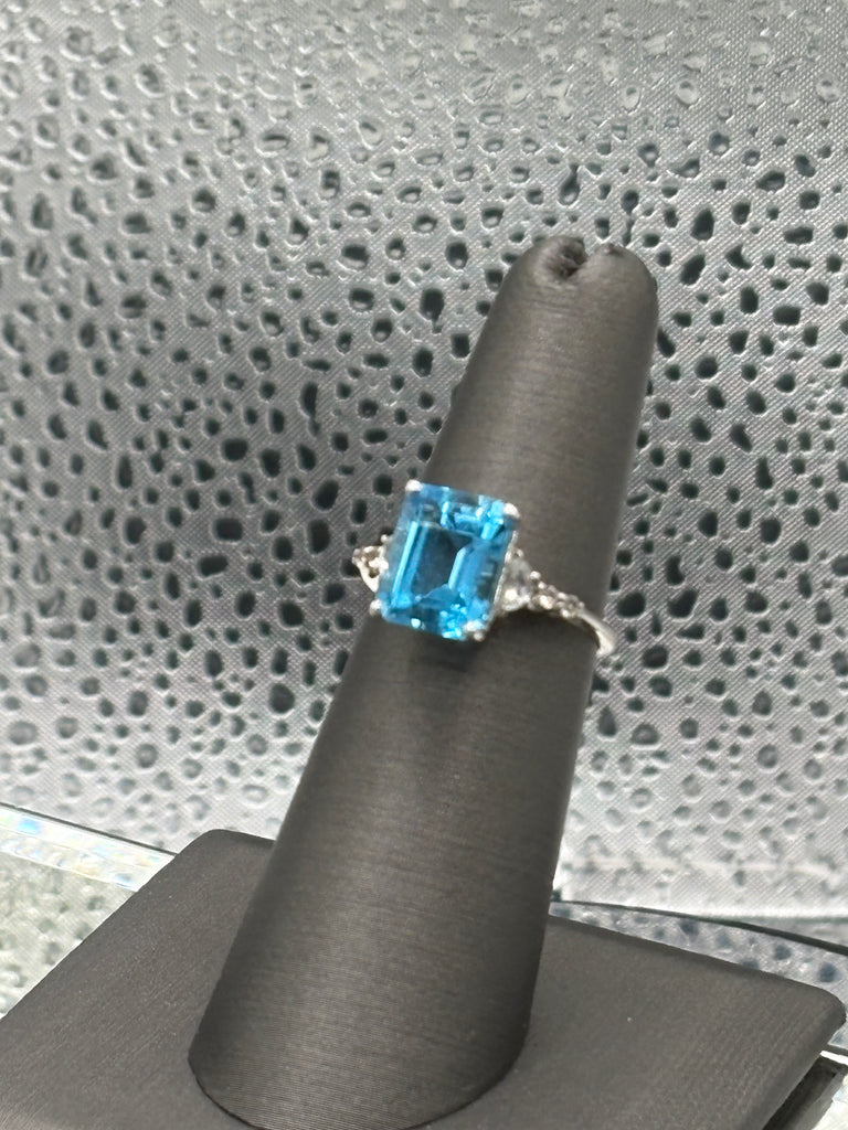 Ladies 10 Karat White Gold Emerald Cut Blue Topaz Ring