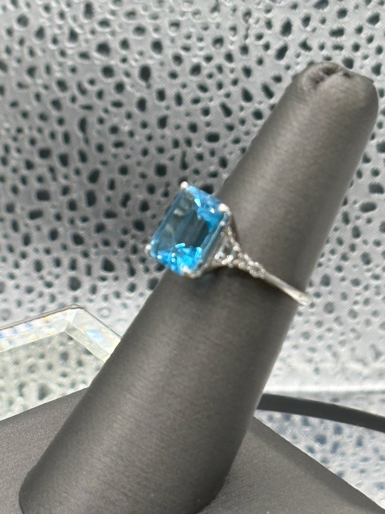 Ladies 10 Karat White Gold Emerald Cut Blue Topaz Ring