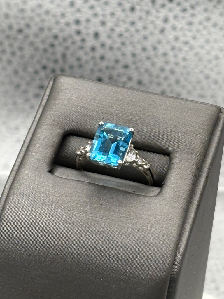 Ladies 10 Karat White Gold Emerald Cut Blue Topaz Ring