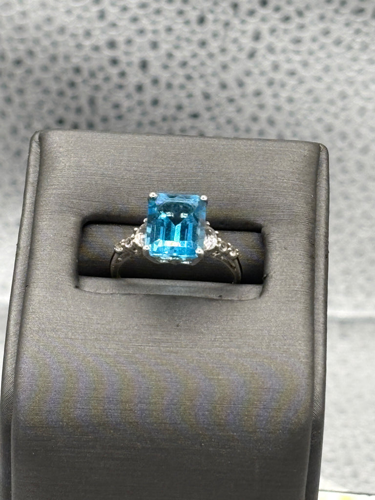Ladies 10 Karat White Gold Emerald Cut Blue Topaz Ring