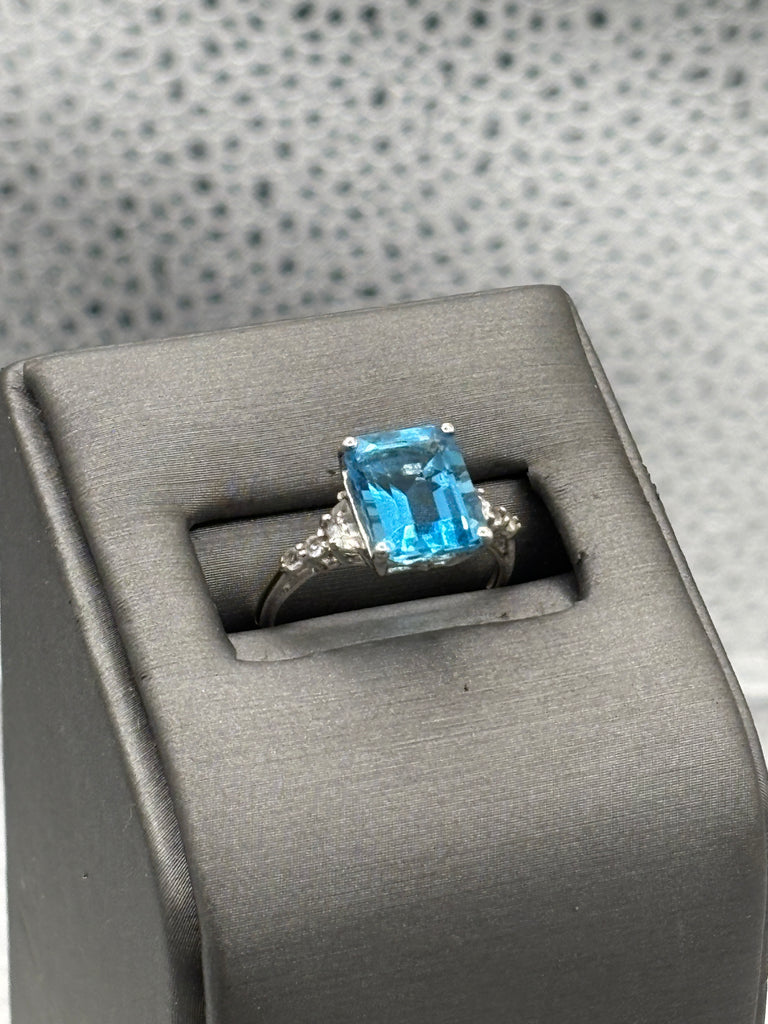 Ladies 10 Karat White Gold Emerald Cut Blue Topaz Ring