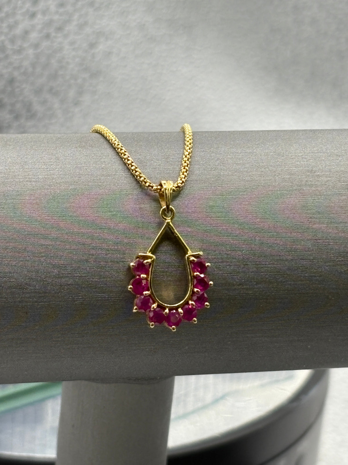 14 Karat Yellow Gold Ruby Horseshoe Pendant Popcorn Necklace
