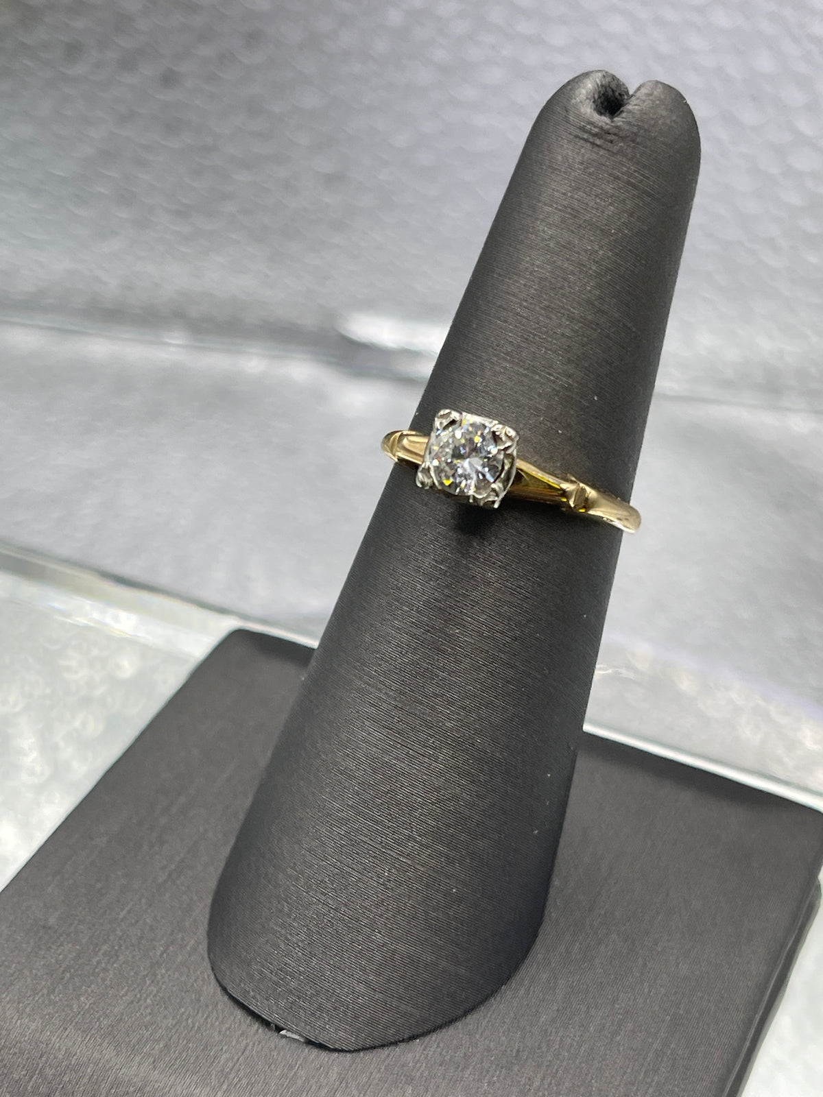 A ladies Vintage 14 Karat Yellow Gold Diamond Engagement Ring