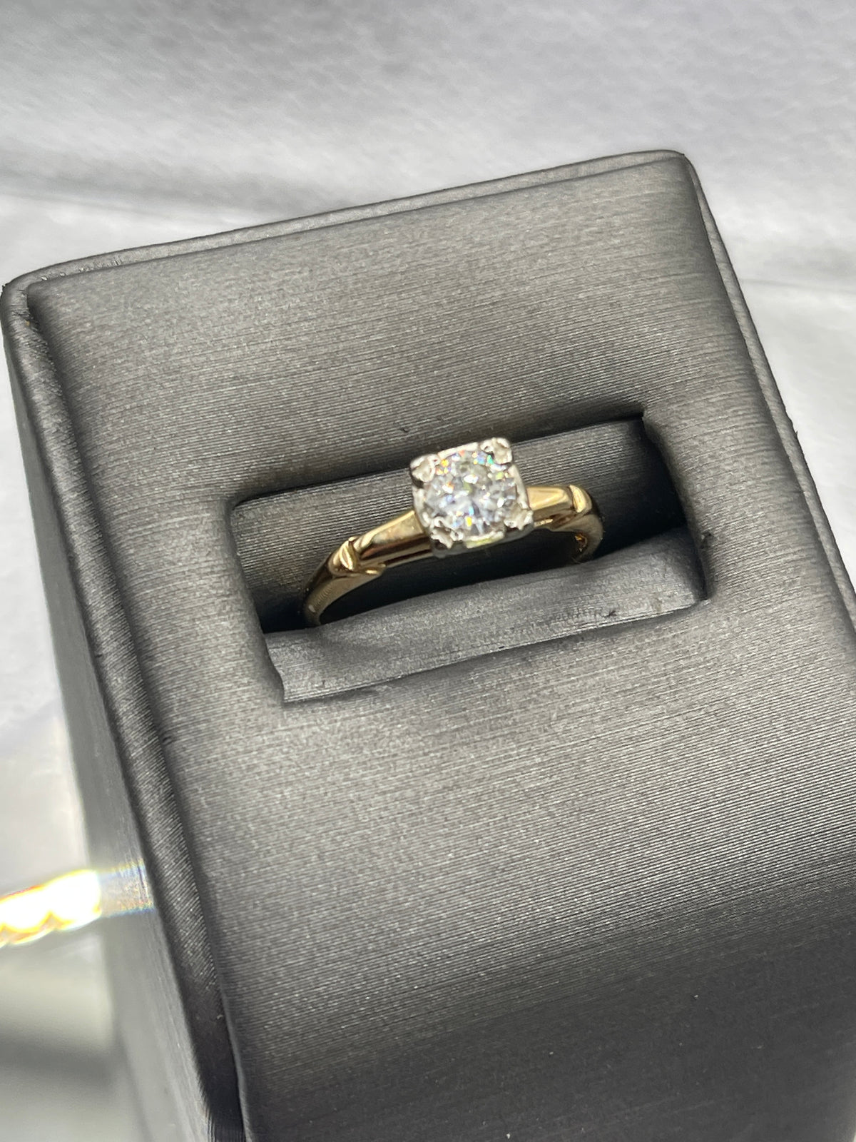 A ladies Vintage 14 Karat Yellow Gold Diamond Engagement Ring