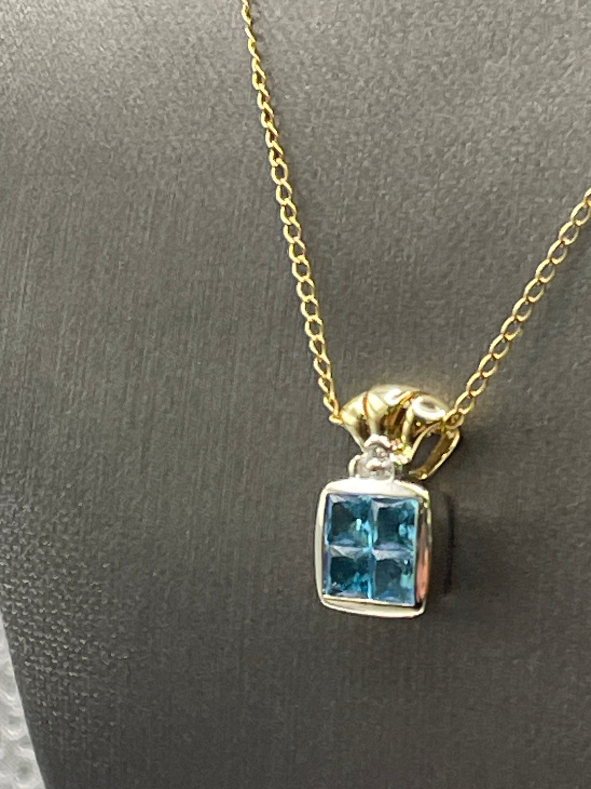 Ladies 14 Karat Solid Two-Toned Gold Blue Topaz and Diamond Pendant