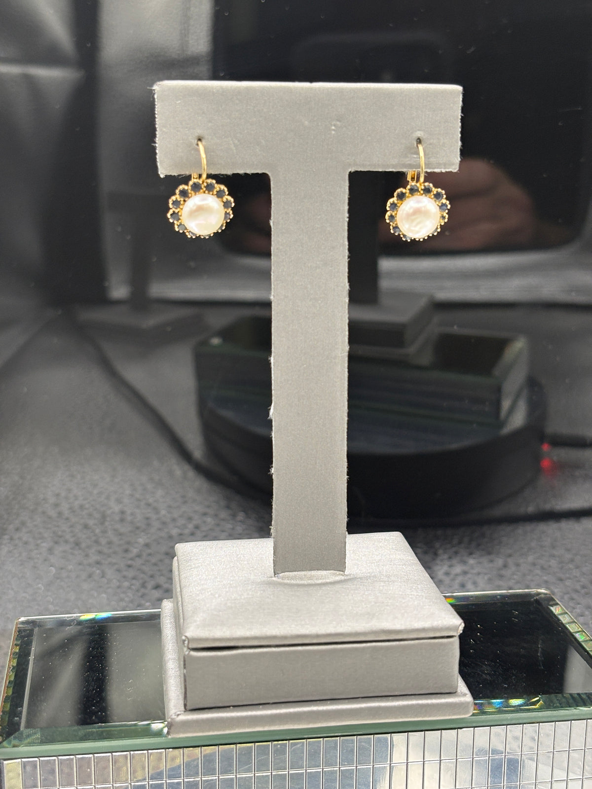 14kt Ladies Pearl earrings with a Sapphire halo encircling the Pearls