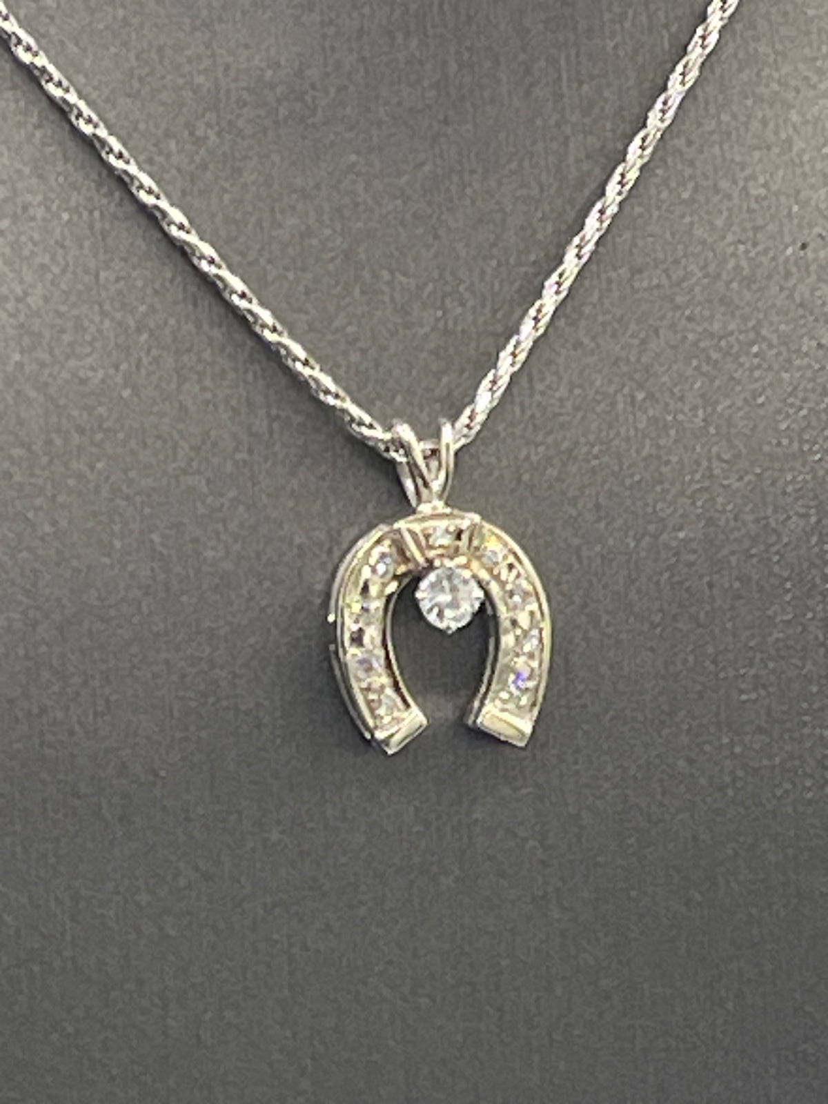 A Classic 14 Karat White Gold Diamond Horseshoe Pendants