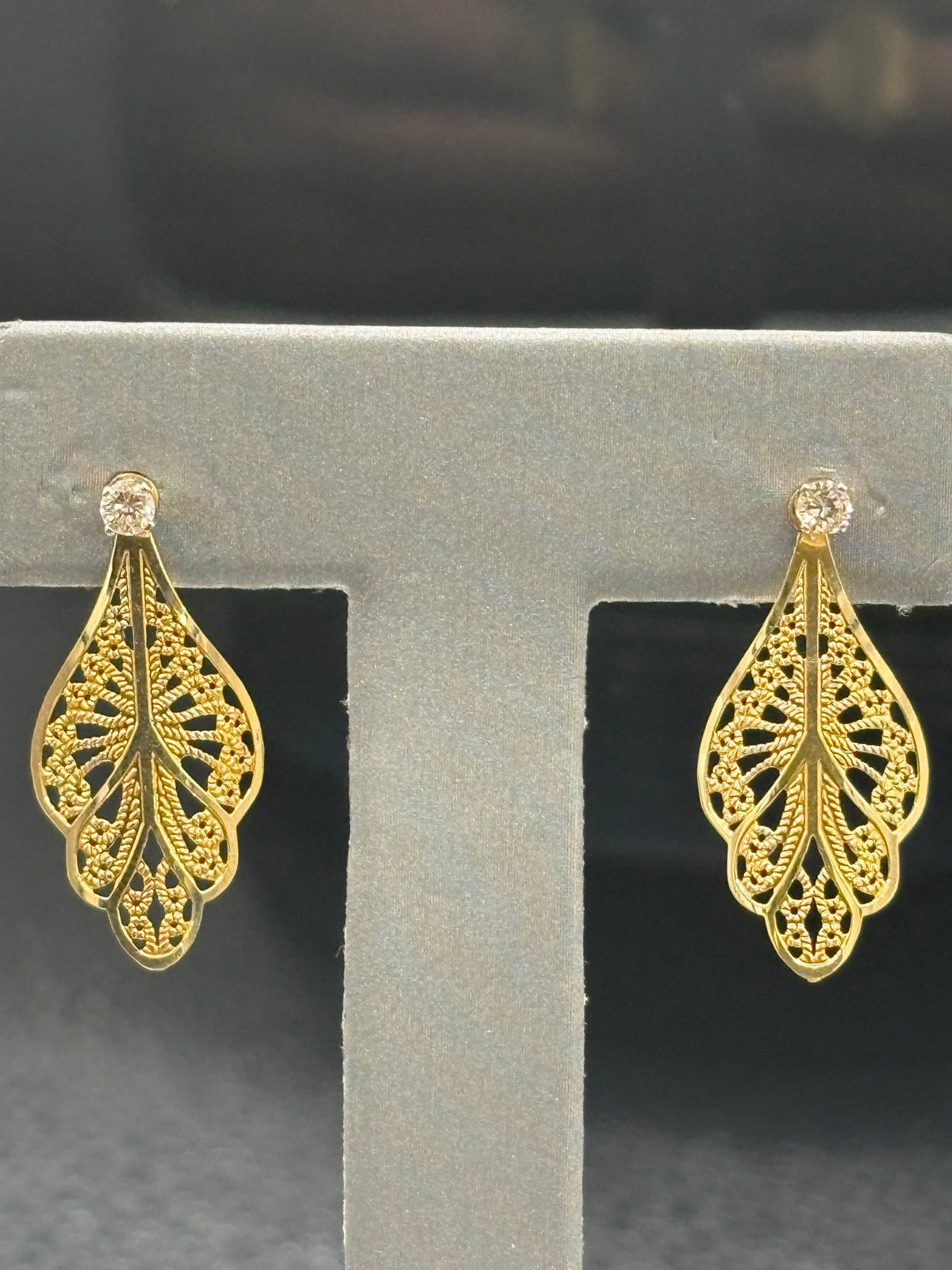 14kt solid yellow gold diamond stud earrings with gold filigree jackets