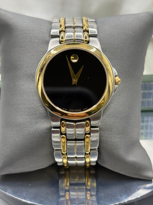 Vintage Movado Mens museum watch with a black dial, two tone yellow and stainless steel bracelet