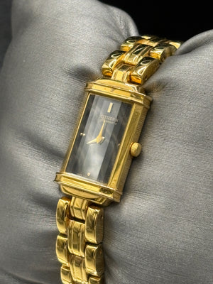 Vintage Citizens Elegance women's tank watch featuring a gold-tone bracelet and a beveled crystal