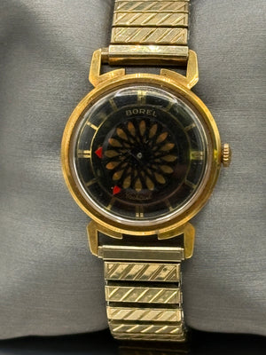 Vintage Ernest Borel Cocktail kaleidoscope watch,features a distinctive kaleidoscope-patterned dial that rotates to create a visual effect