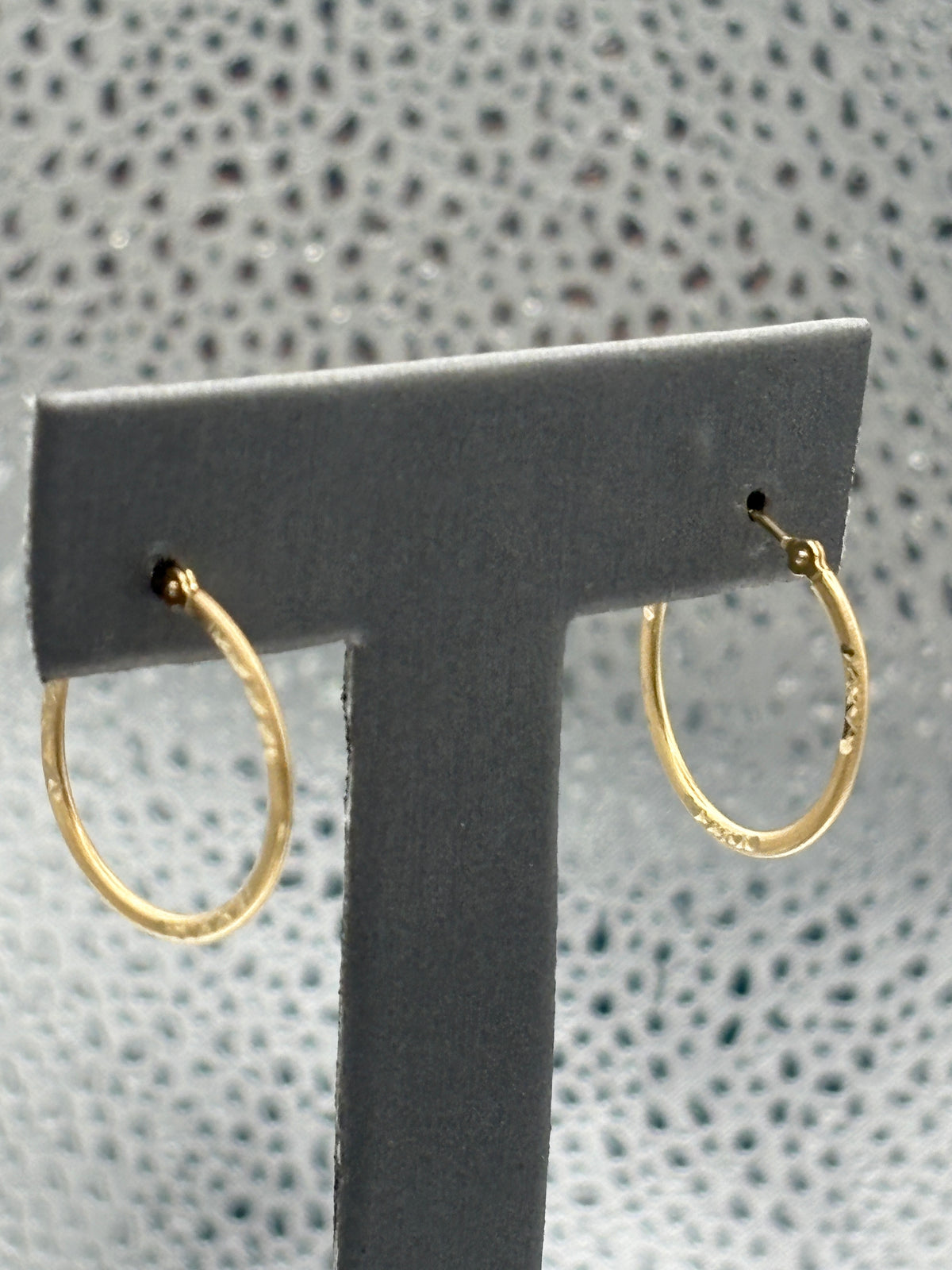 View one of Ladies beautiful 14 Karat Yellow Gold Diamond-Cut Hoop Earrings