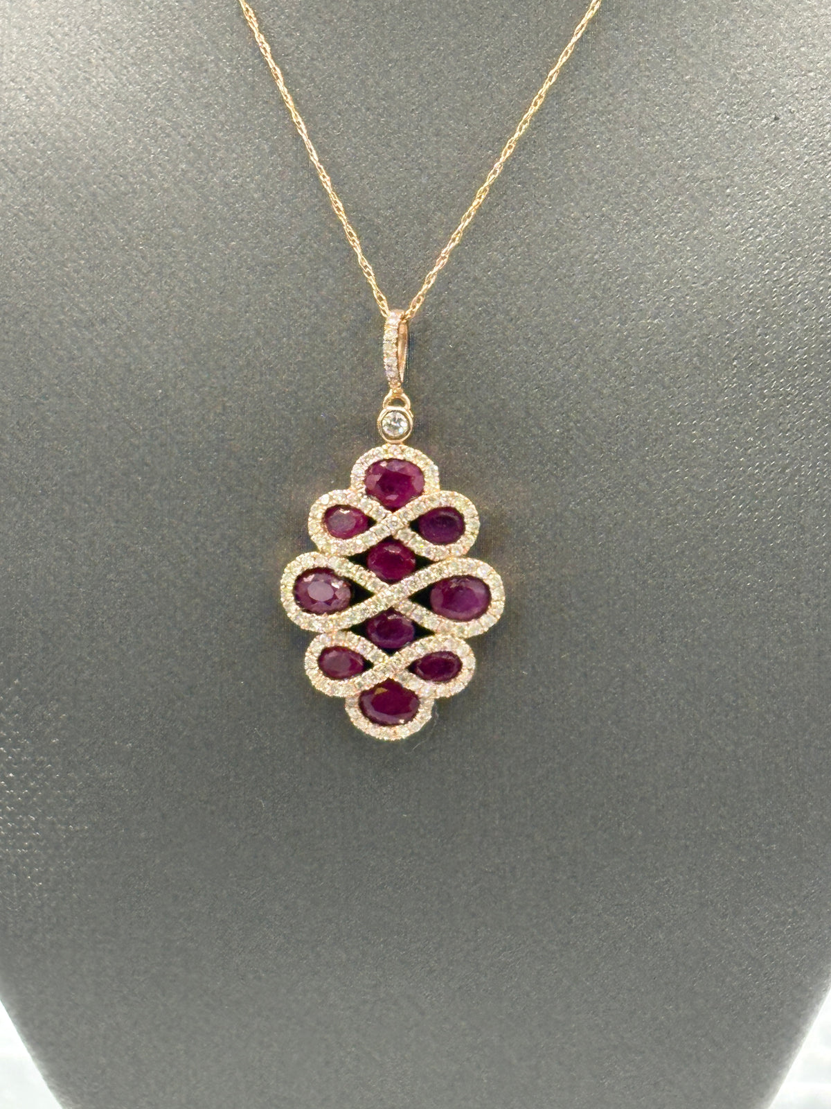View two of Ladies 14 Karat Rose Gold Ruby/Diamond Pendant & Chain